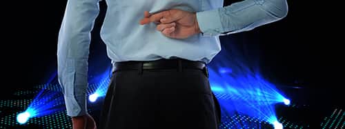 fingers crossed behind the back