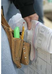 Contractor toolbelt and building plans