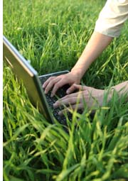 working on laptop on lawn